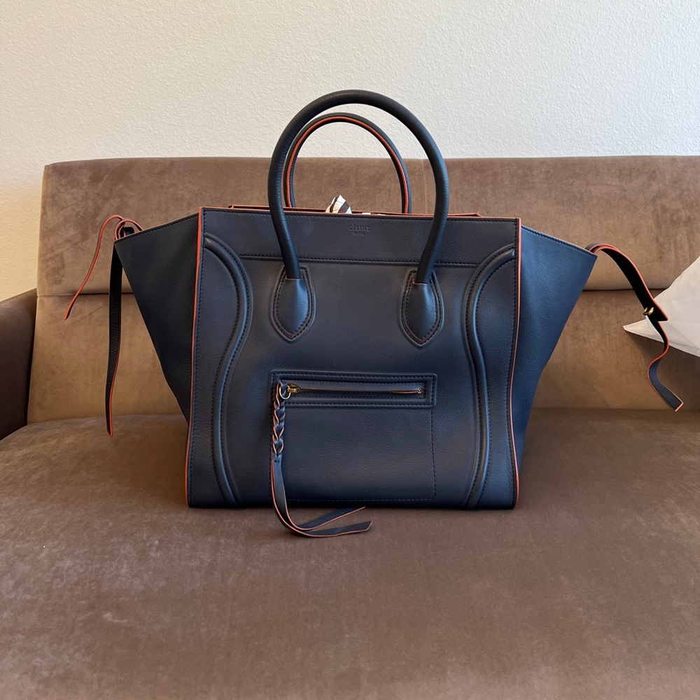 AUTHENTIC Celine Large phantom luggage Tote, Navy Blue leather + orange trim.